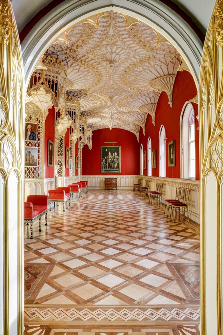 The Gallery from the aisle, gold canopies and portraits lining the crimson walls, Strawberry Hill House