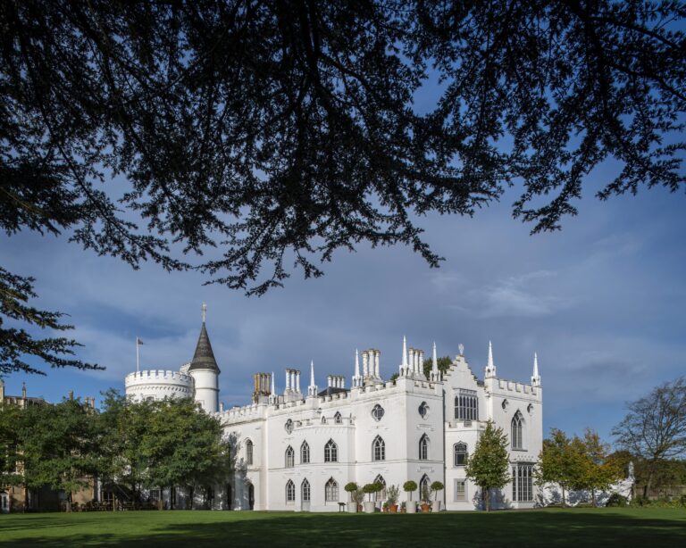 The battlements, pinnacles and white rendered front of Walpole's Gothic Revival villa, Strawberry Hill House
