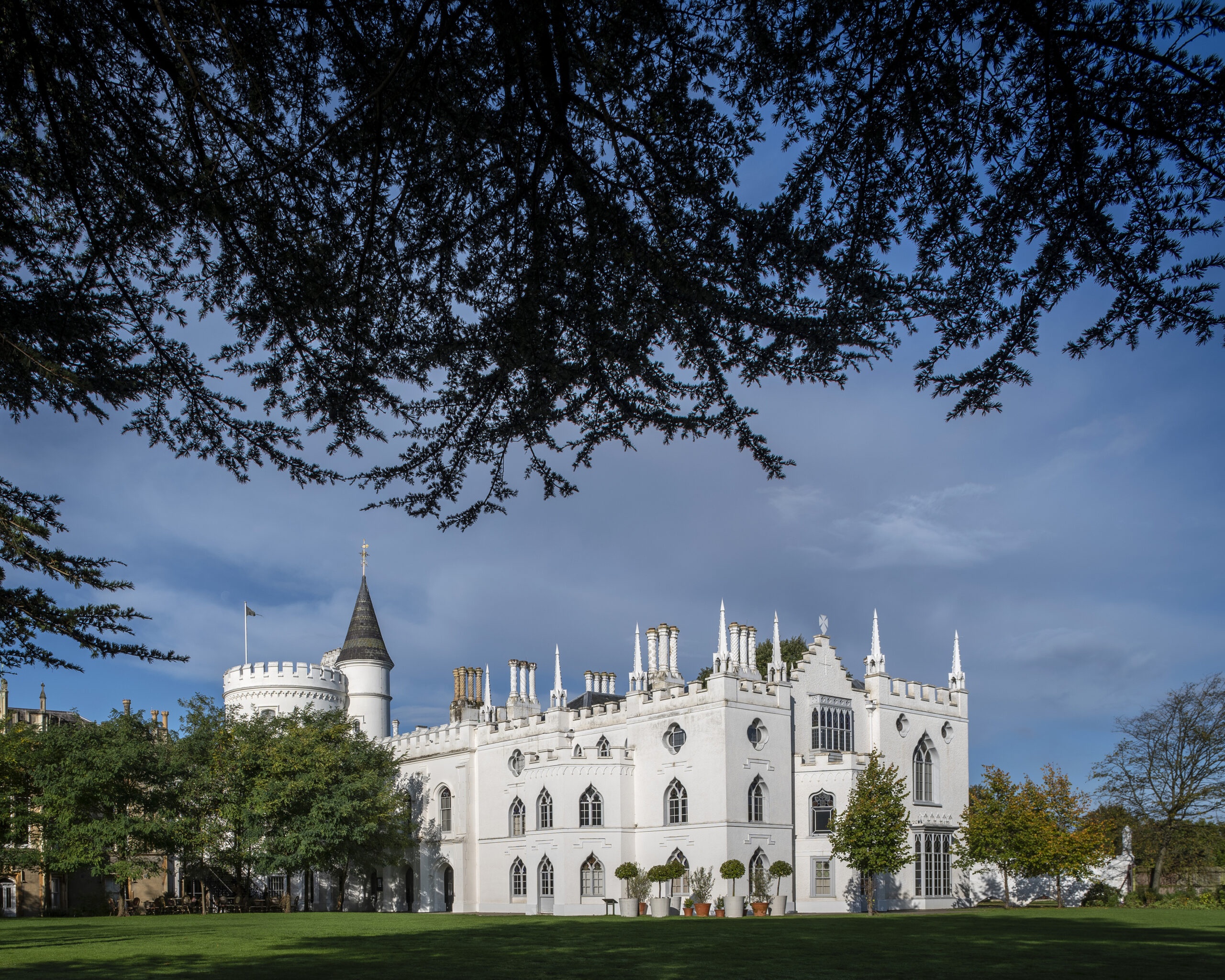 The battlements, pinnacles and white rendered front of Walpole's Gothic Revival villa, Strawberry Hill House