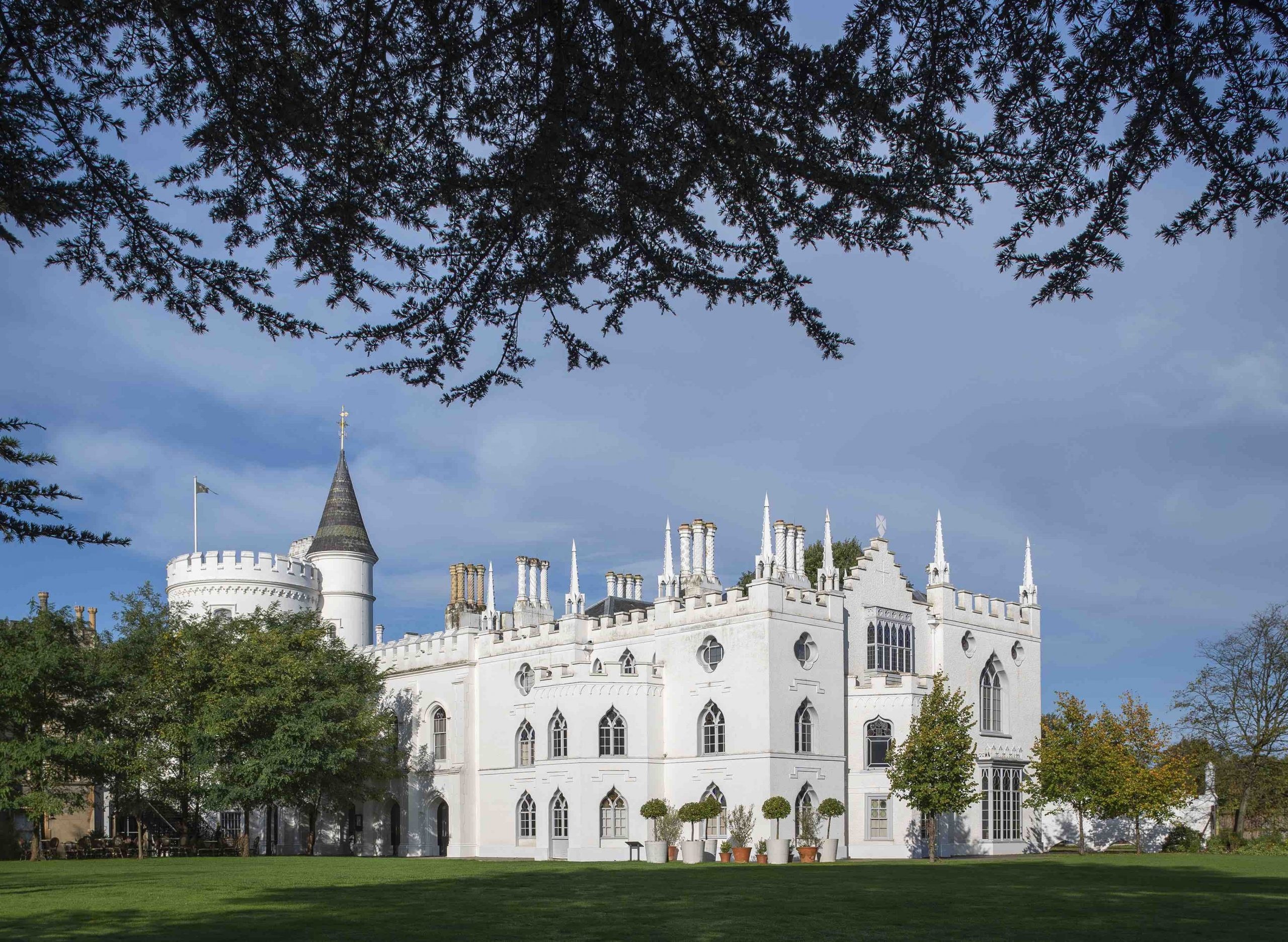 The house glimpsed across the garden, framed by the branches of a mature cedar, Strawberry Hill House