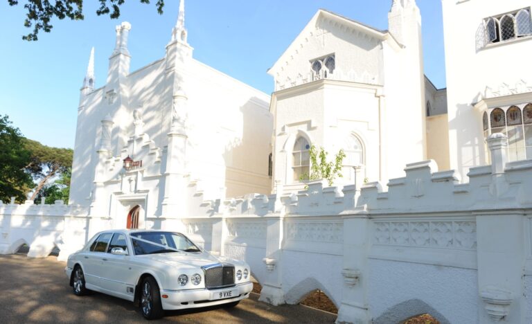 The front of the house, its battlemented Gothic facade seen across the grass, Strawberry Hill House