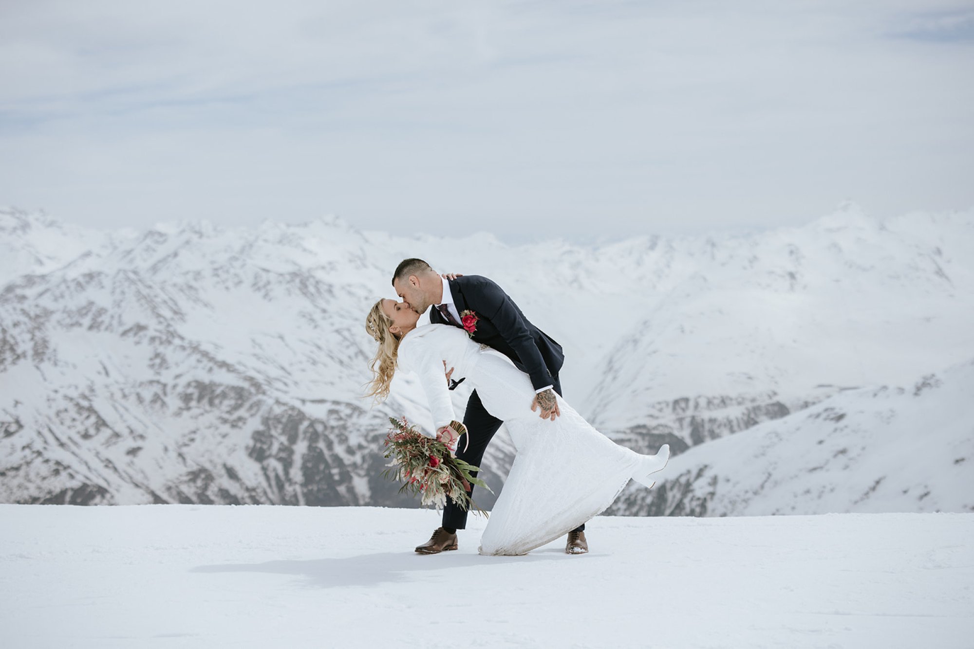 Couple dancing in the snow above Sölden, Tyrol, after their elopement ceremony at the iceQ, Stressfree Weddings by SandraM