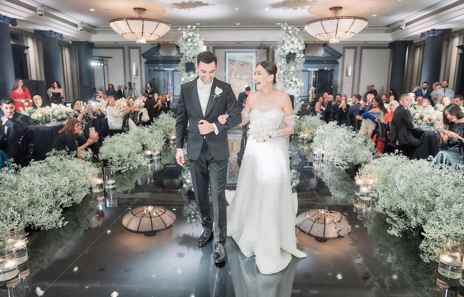 Newlyweds walking back down the aisle at Rosewood London, Stuart Wood Photography