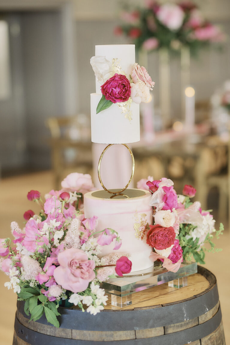 A wedding cake dressed with peonies and roses at Boturich Castle, Stuart Wood Photography