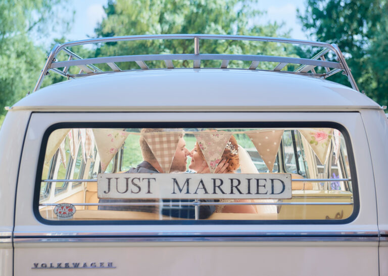 A couple seen through the back window of a Just Married campervan, The West Mill, Derbyshire, Stuart Wood Photography