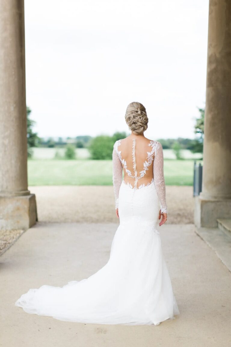 A Bride in a Lace-Back Gown Under the Portico of Stubton Hall, Stubton Hall