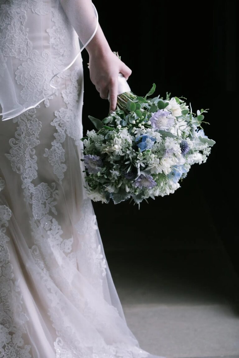 A Bride Holding a Blue Hydrangea Bouquet at Stubton Hall, Stubton Hall