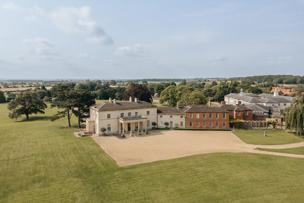 An aerial view of Stubton Hall, its gravel drive and the parkland around it