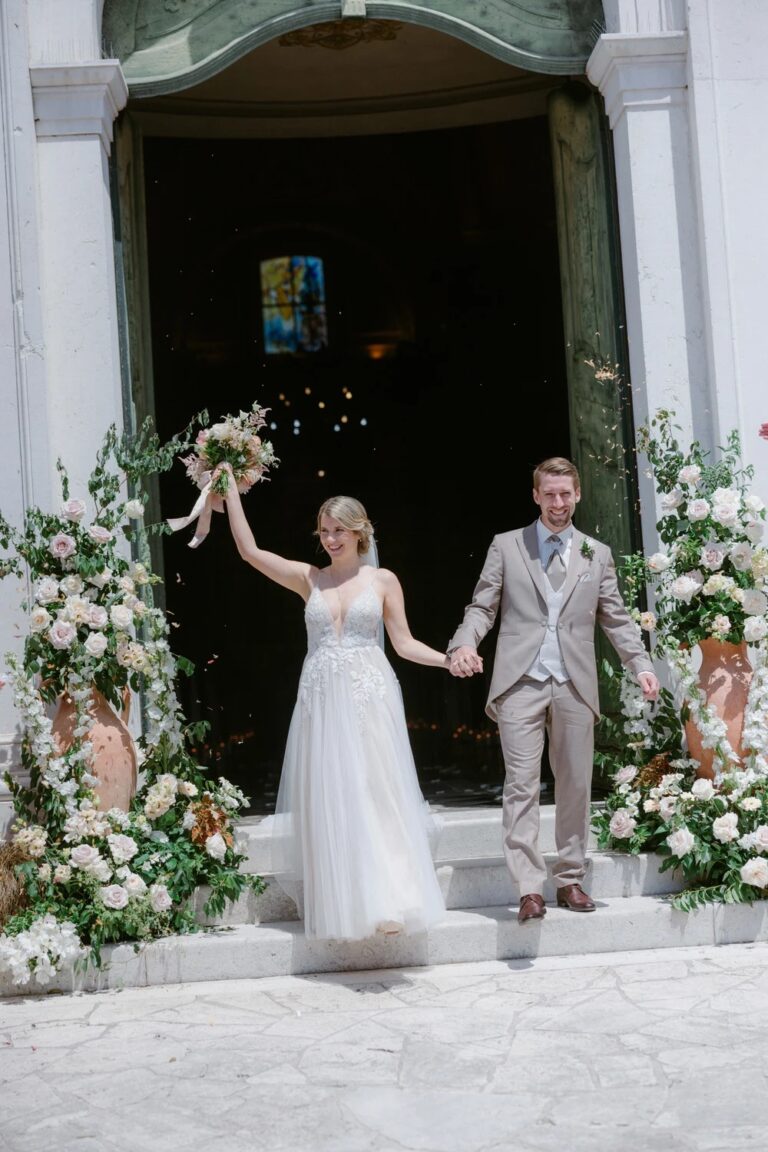 Bride and groom stepping out of the church after the ceremony, on a two-day wedding weekend at Castello di Spessa, Studio Fotografico Bacci