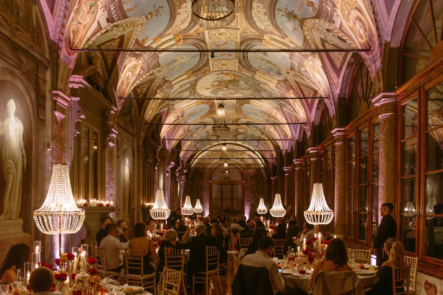 Dinner under chandeliers in the frescoed gallery of Villa Corsini a Mezzomonte, outside Florence, Studio Fotografico Bacci