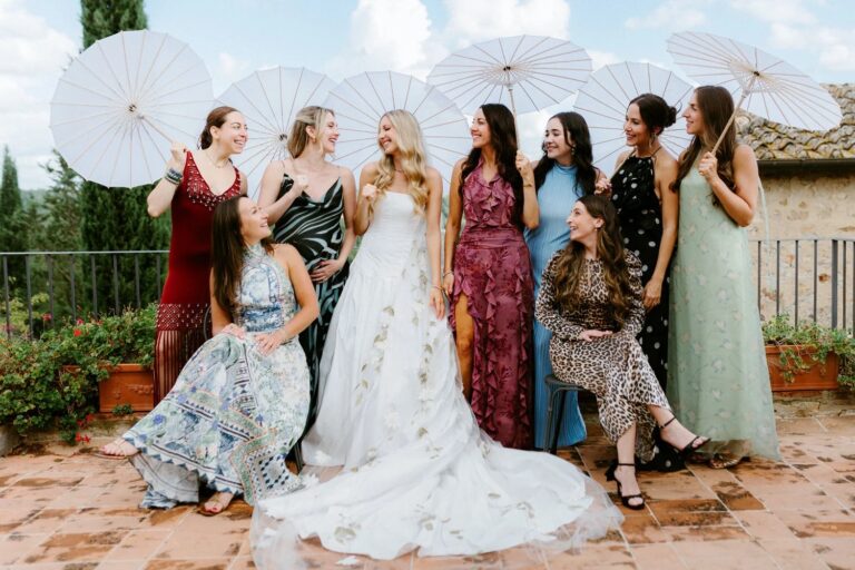 The bride with her friends and white paper parasols on the terrace at Borgo Casabianca, Tuscany, Studio Fotografico Bacci