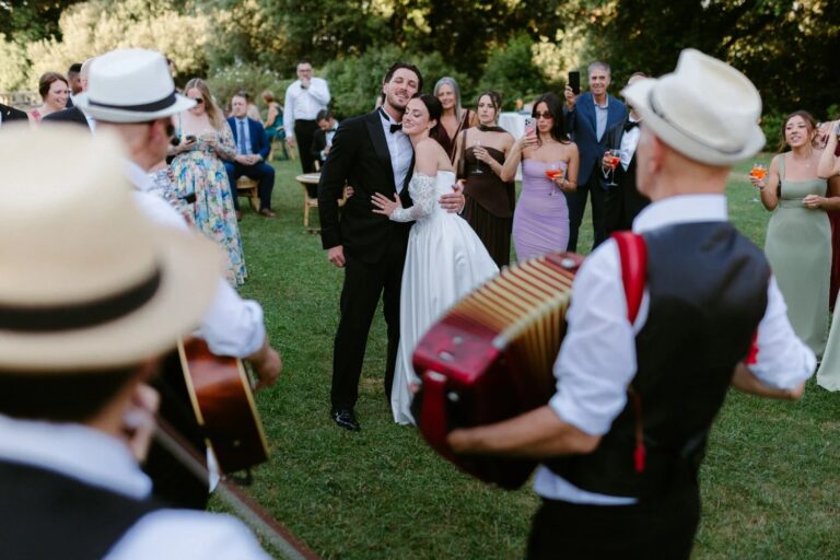 Musicians serenading the couple and their guests in the garden at Tenuta di Artimino, Studio Fotografico Bacci