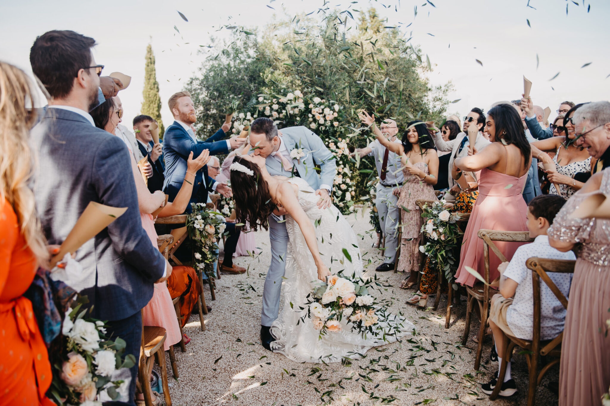 Petals thrown as they pass, the wedding party either side, Studio27 by Andreas Politis Photography and Cinematography