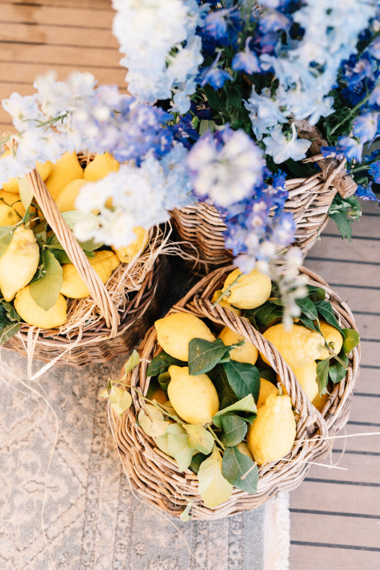 Wicker baskets of lemons with blue delphinium for a welcome party on the Amalfi Coast, Suellen Fernandes Weddings & Celebrations