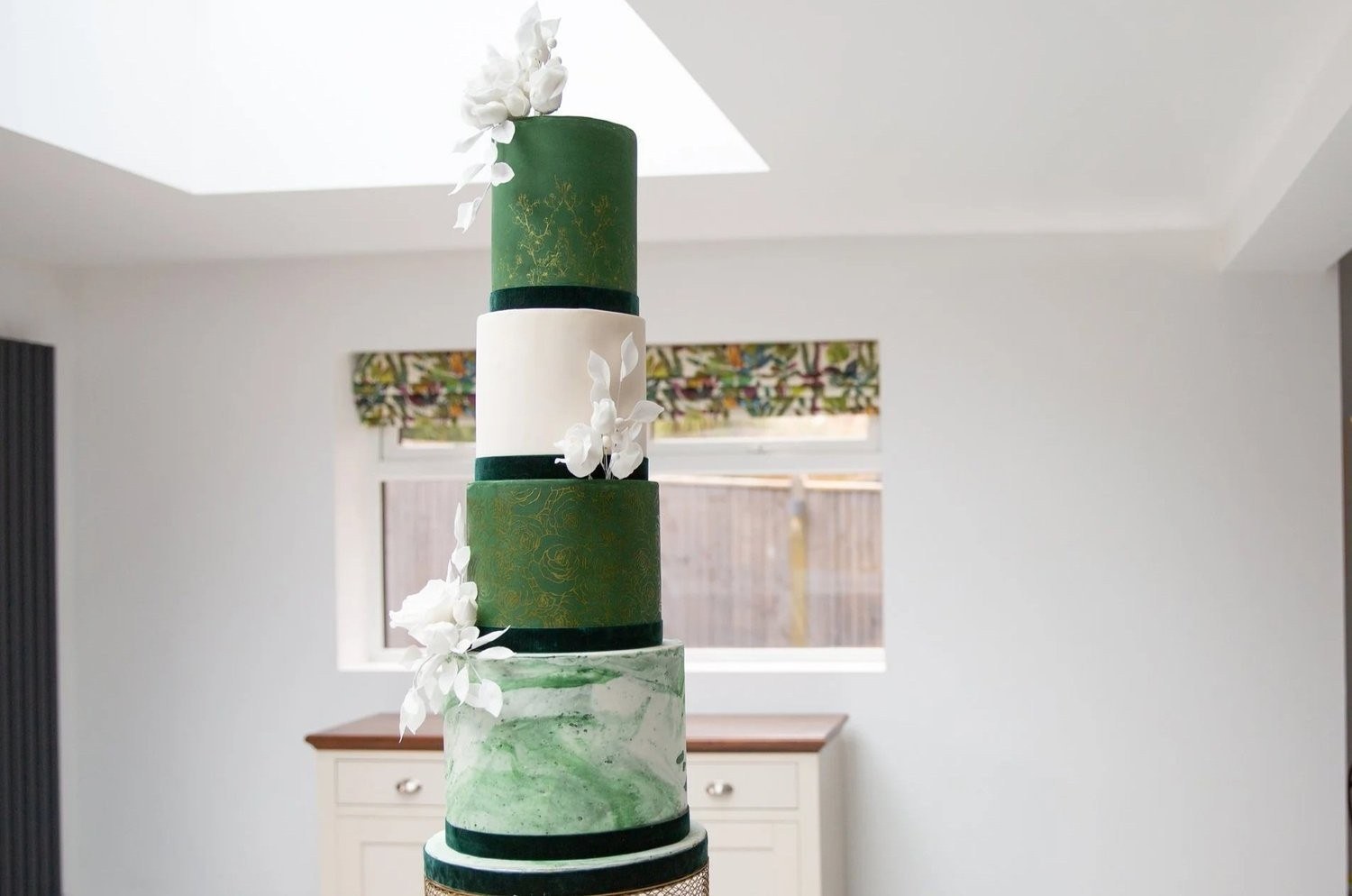 A green marbled wedding cake with a white sugar flower, Sugar and Spiced Cakes