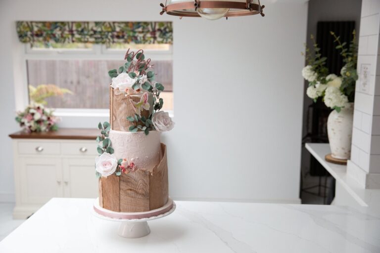 A copper and pink wedding cake with sugar flowers, Sugar and Spiced Cakes