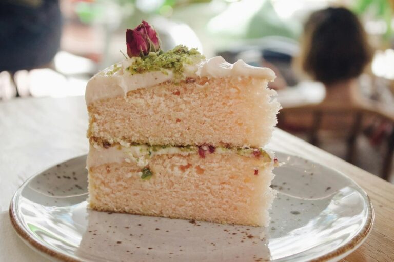 A slice of sponge cake with a pistachio and jam filling, Sugar and Spiced Cakes