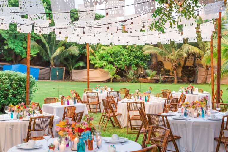 Garden reception under strings of papel picado, SunHorse Weddings