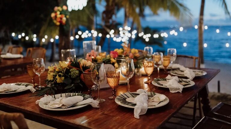 Candlelit table beside the water, SunHorse Weddings