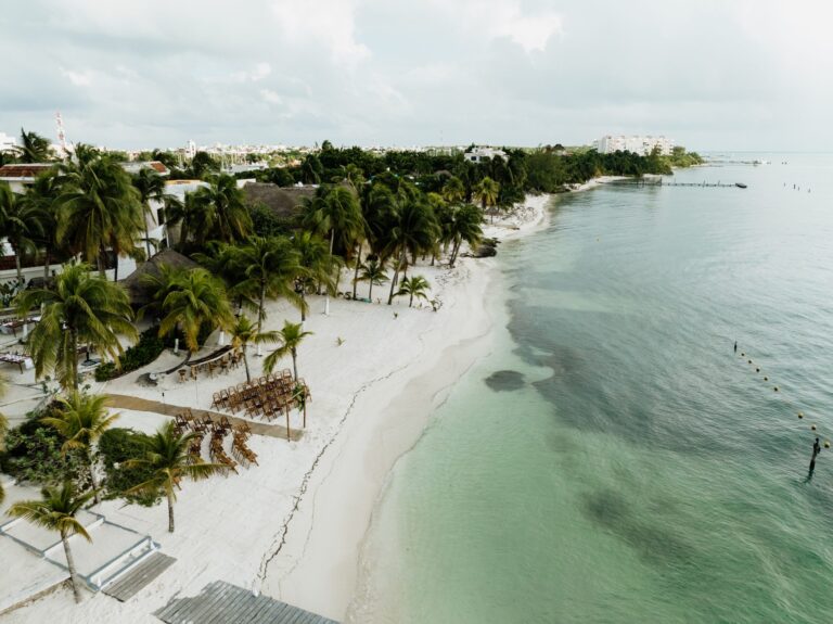 Aerial view of the white sand coast of Isla Mujeres, SunHorse Weddings