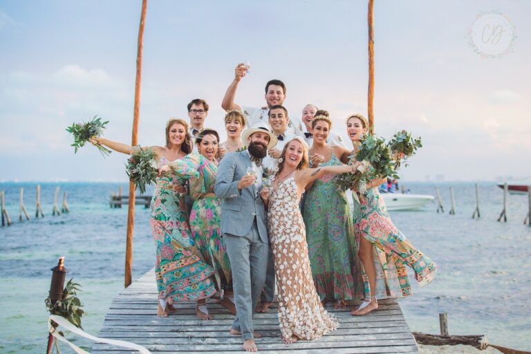 Wedding party on a wooden pier over the water, SunHorse Weddings