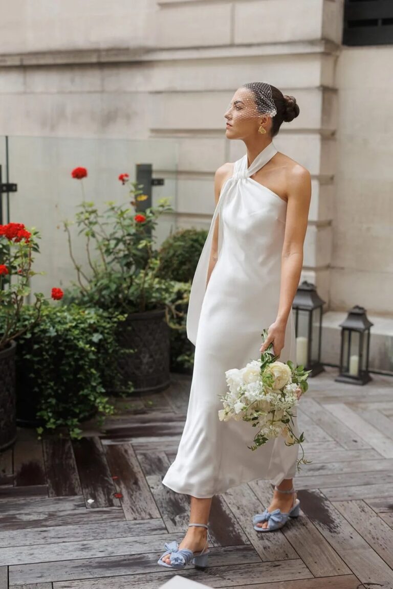 Emily's portrait, bouquet in hand, the garden terrace at The Ned, Sweet Pea Floral Design