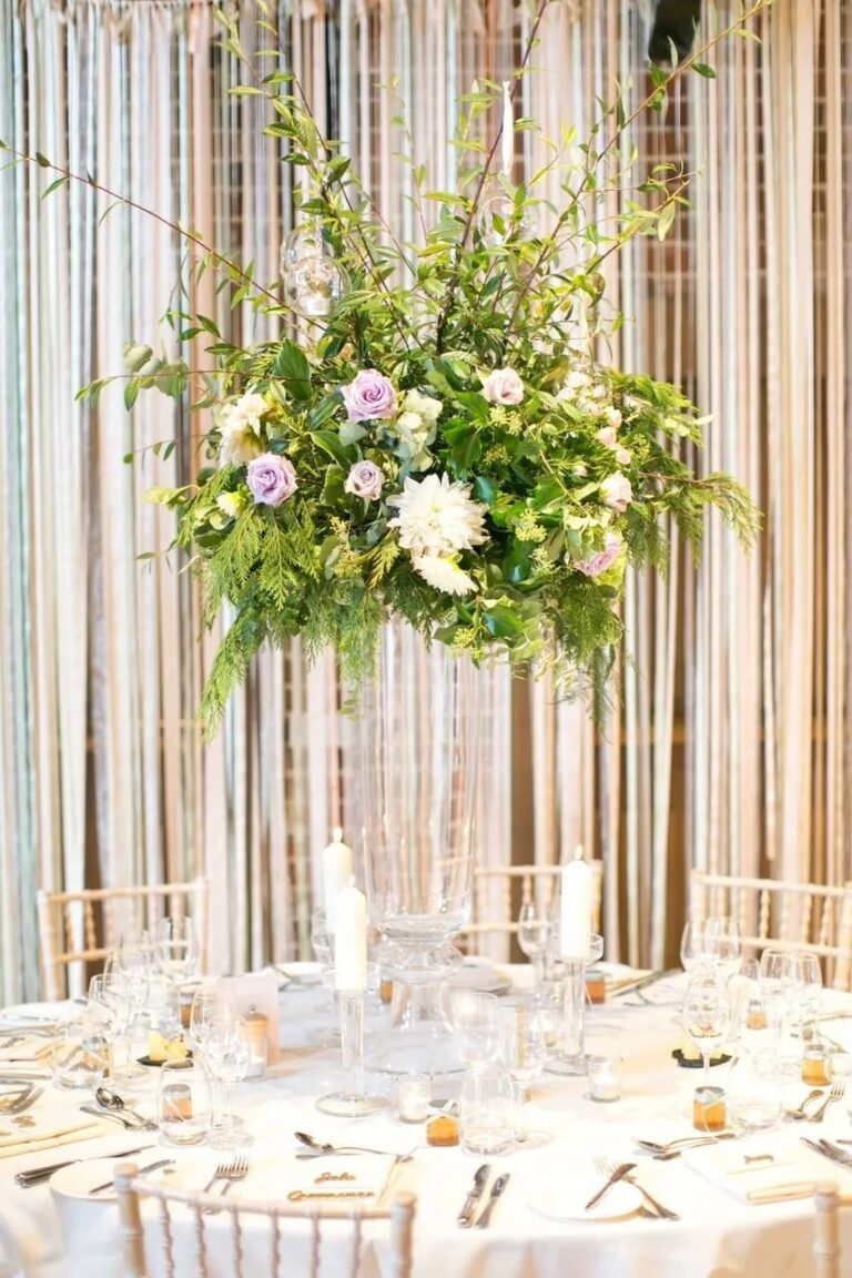A tall centrepiece on a mirrored plinth, the Gaynes Park reception, Sweet Pea Floral Design