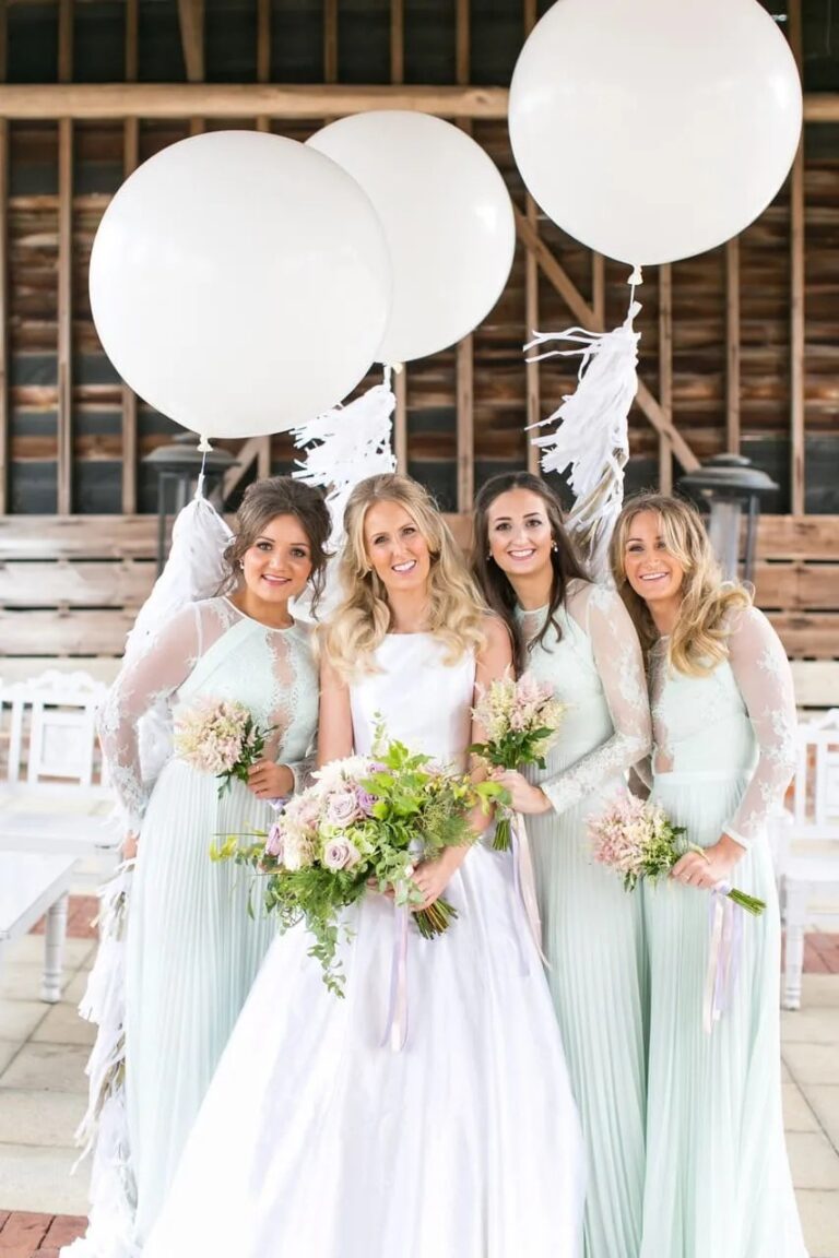 Bridesmaids in sage green, white balloons, Gaynes Park, Sweet Pea Floral Design