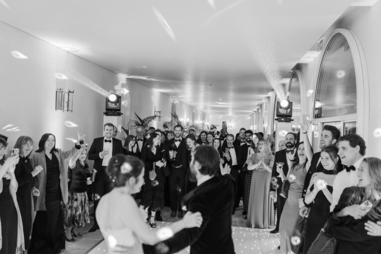 A first dance surrounded by cheering guests against a curtain of fairy lights, Syon Park