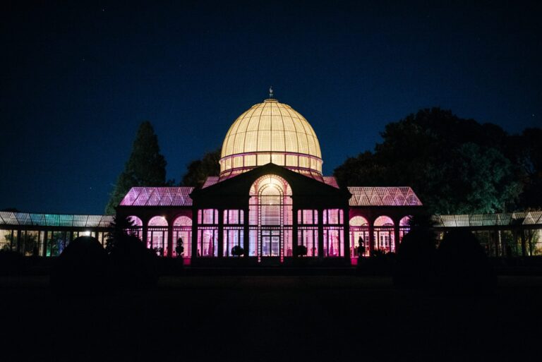 The Great Conservatory lit rose-pink for an evening reception, Syon Park