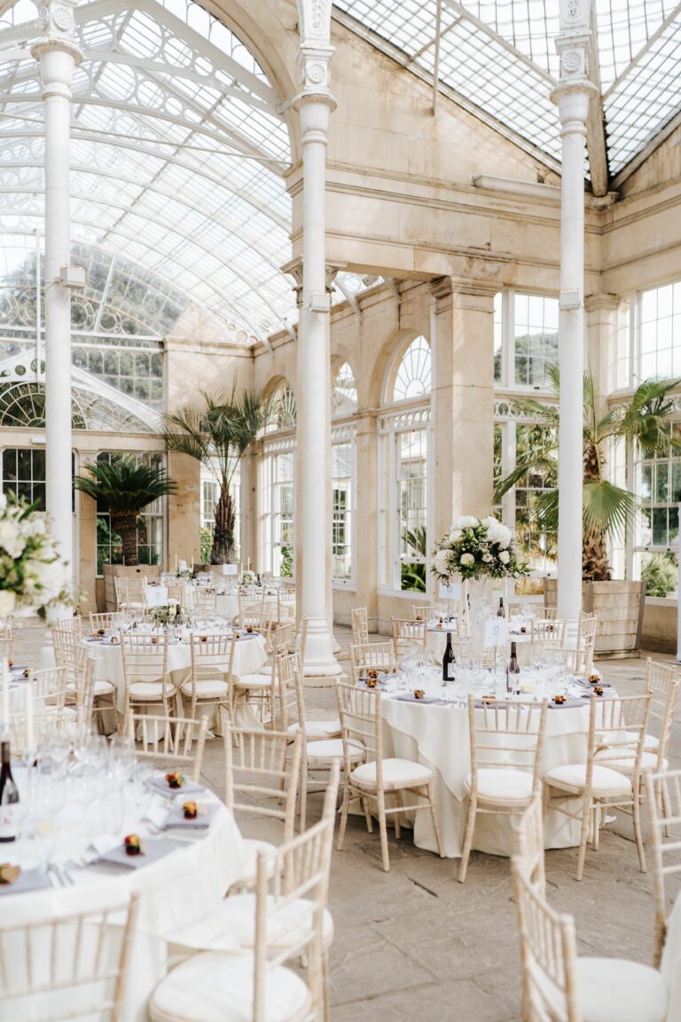 Long tables set beneath the glass of the Great Conservatory, Syon Park