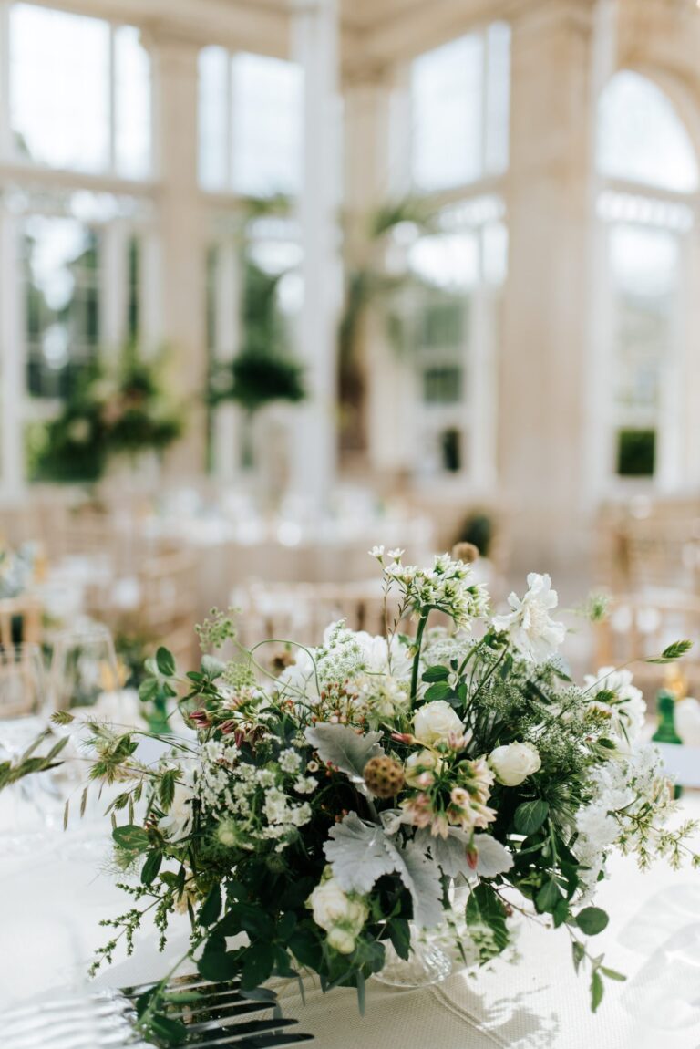 Floral centrepieces running the length of a Conservatory table, Syon Park