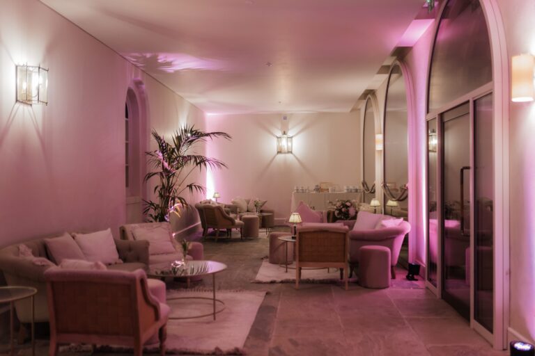 The Colonnade lounge lit rose for the evening, Syon Park