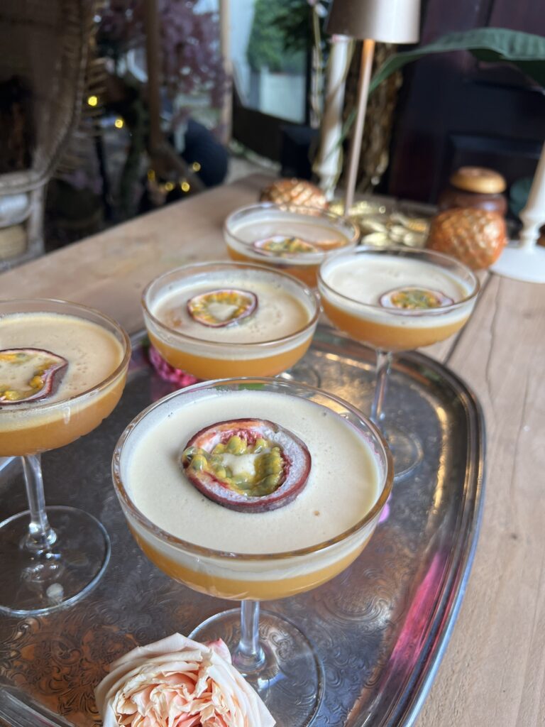 Passion fruit desserts in coupe glasses on a silver tray, Tan House Newland