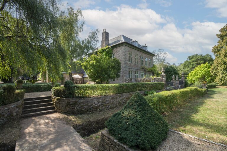 Stone steps and clipped topiary in the terraced garden below the house, Tan House Newland