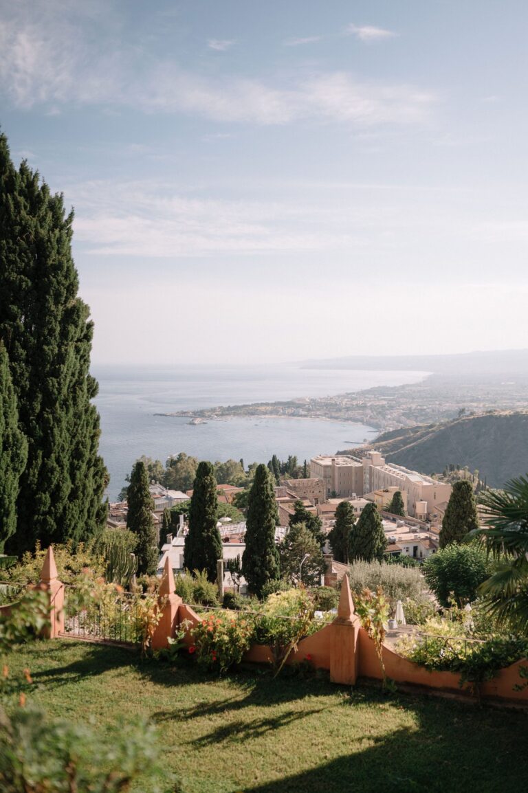 The Ionian coast seen from a Taormina garden, cypresses in the foreground, Taormina Weddings
