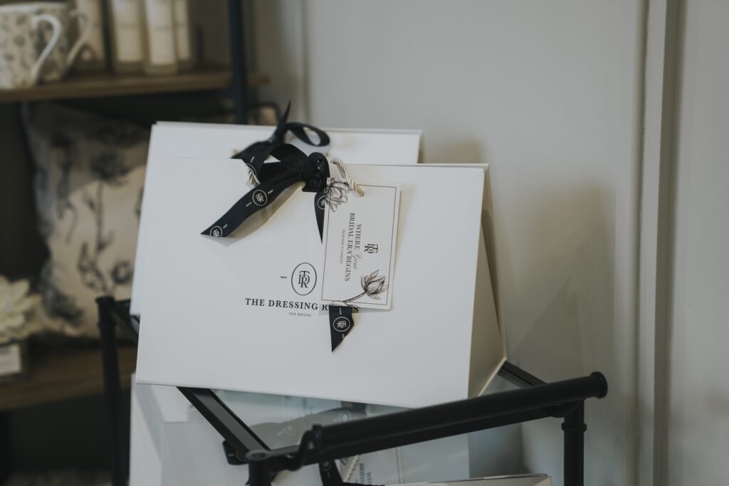 A TDR gift box tied with black ribbon, given to brides who order a dress