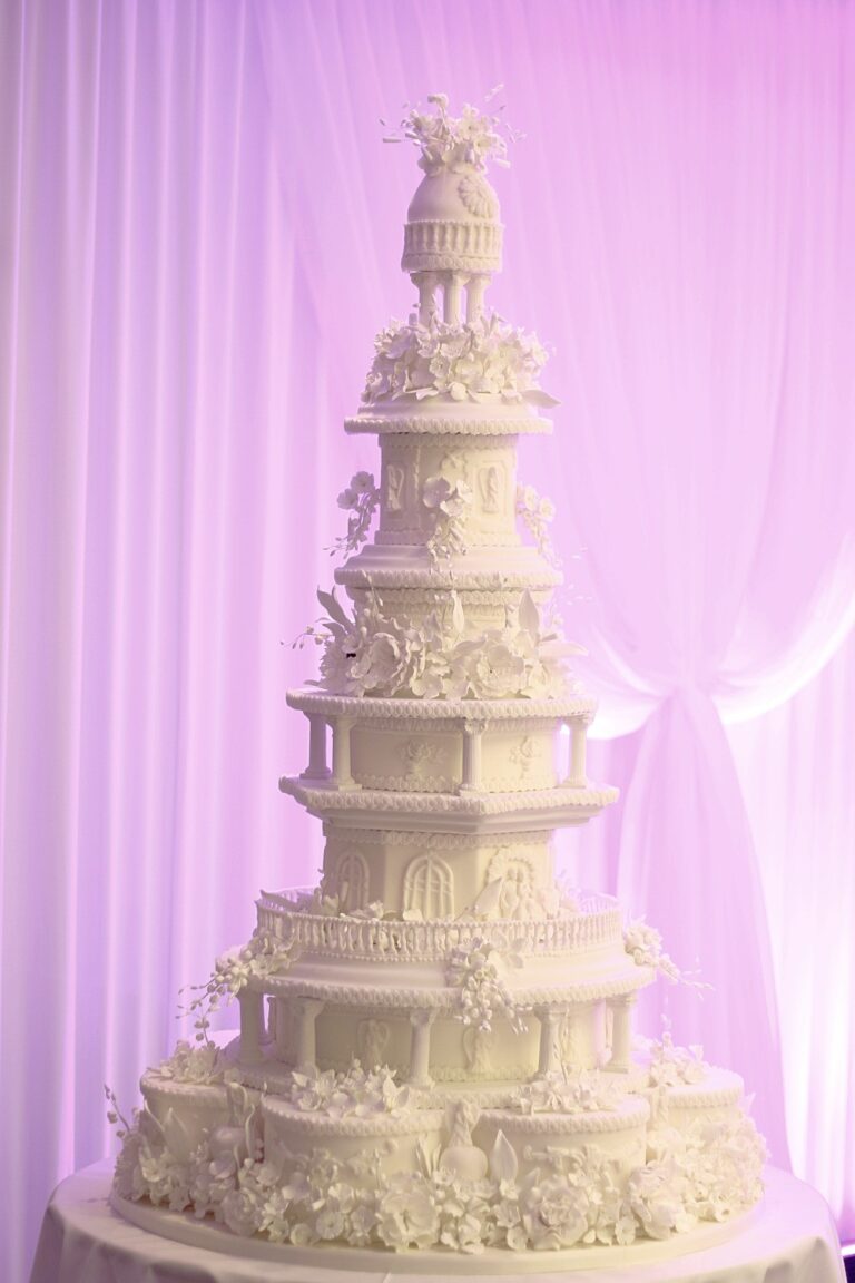A very tall ivory cake built in stepped pagoda style with fine sugar work, Tees Bakery