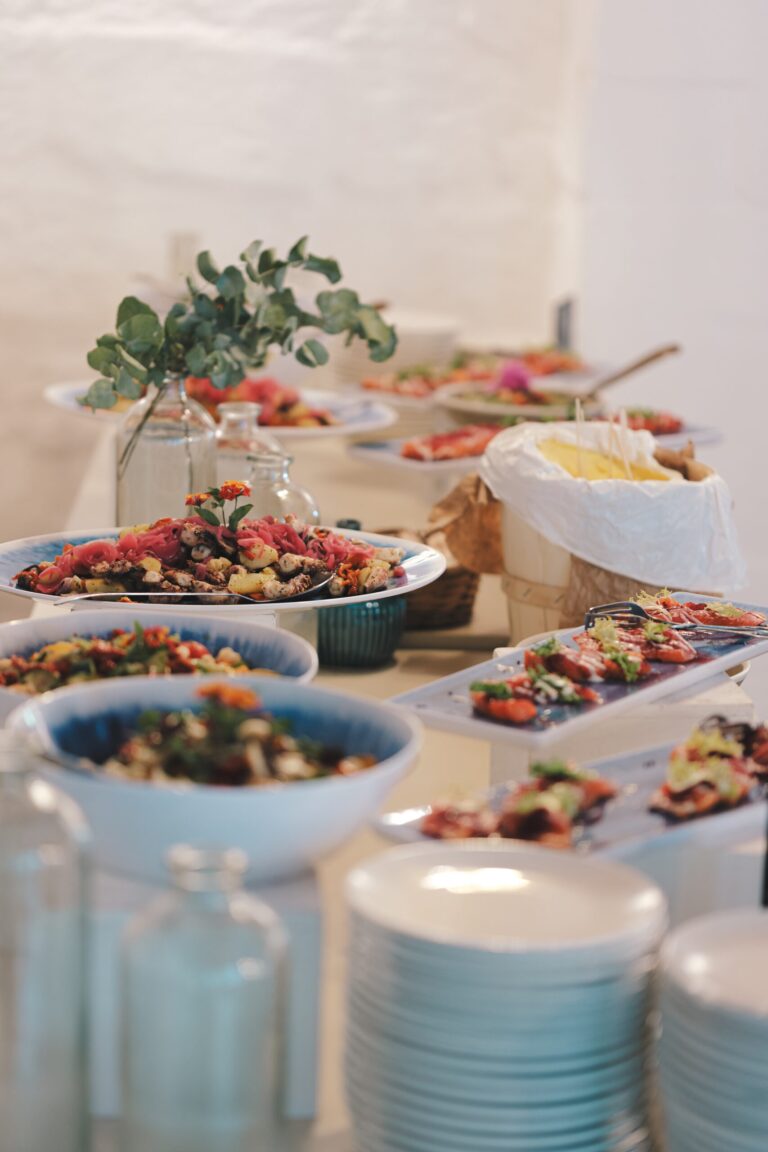 A buffet of salads and plates laid out at a reception on the estate, Tenuta Pinto