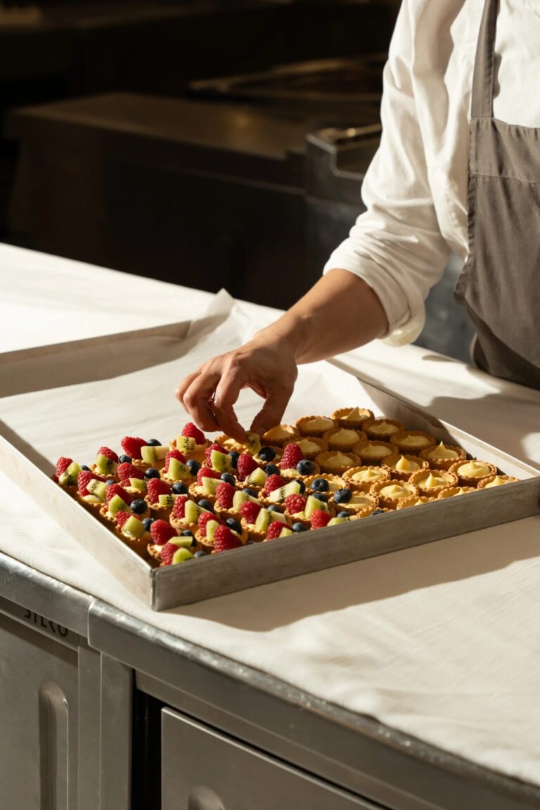 Small tarts with fresh fruit laid out on a tray in the kitchen, Tenuta Pinto