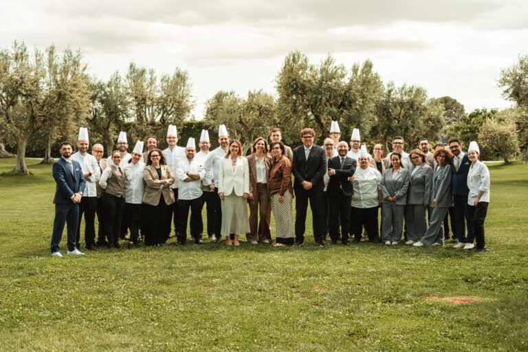 The Pinto family and the Tenuta Pinto team on the lawn among the olive trees, Tenuta Pinto