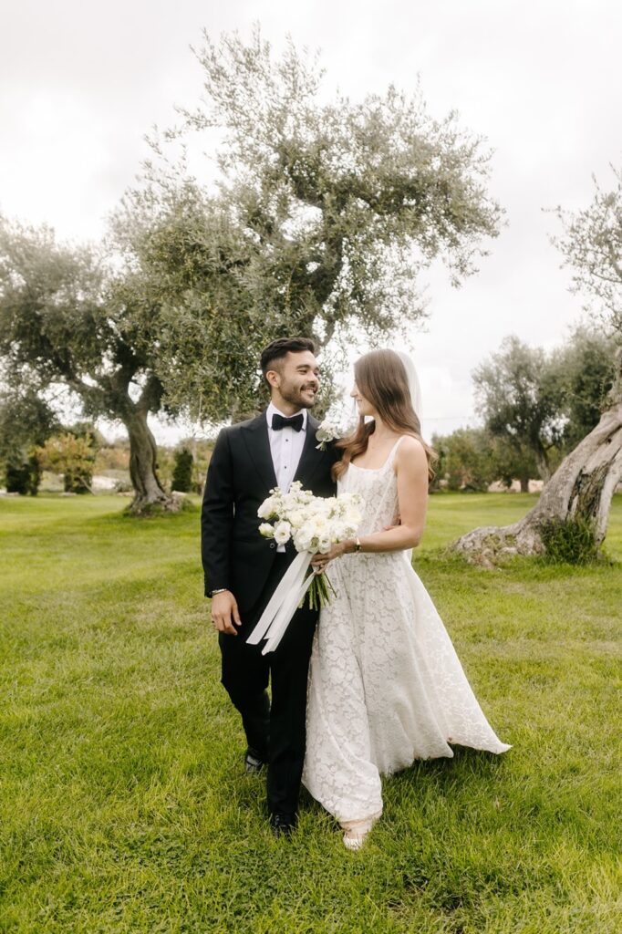 Thomas and Claudia on the lawn among the olive trees after the ceremony, Tenuta Pinto