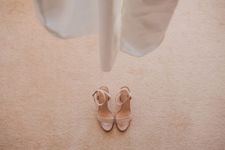 Bridal sandals beneath the hem of the dress, TFY Weddings