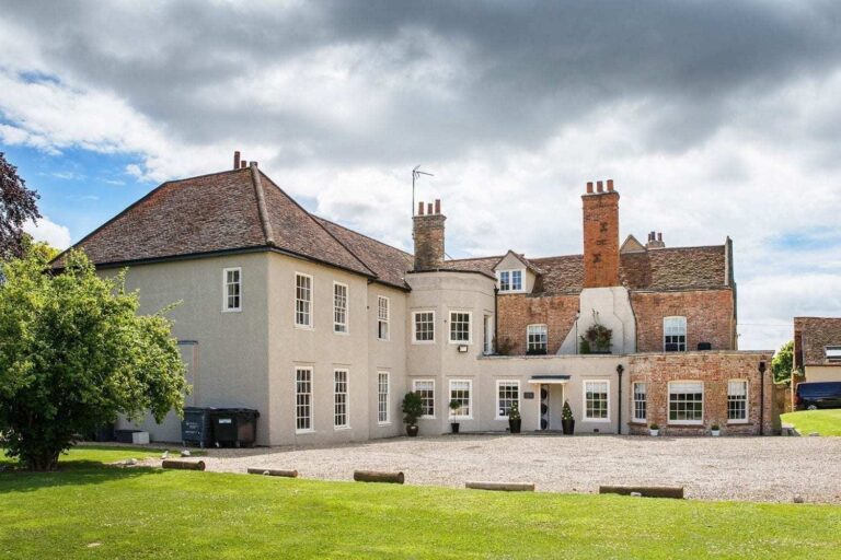 The forecourt side of the house, where the rendered wing meets the older red brick wing, That Amazing Place