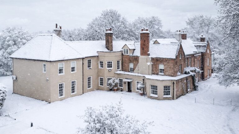 The house and gardens under snow in winter, That Amazing Place