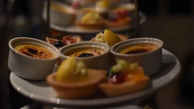 Dessert canapés of crème brûlée and fruit tartlets on a tiered stand, That Amazing Place