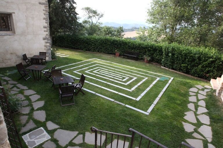 The formal garden's clipped hedges seen from above, The Abbazia San Faustino