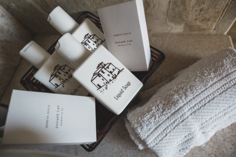 Bath amenities and rolled towels in a suite of the abbey, The Abbazia San Faustino