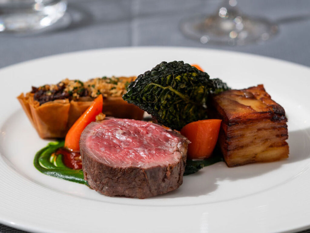 A beef fillet main course with kale and potato terrine