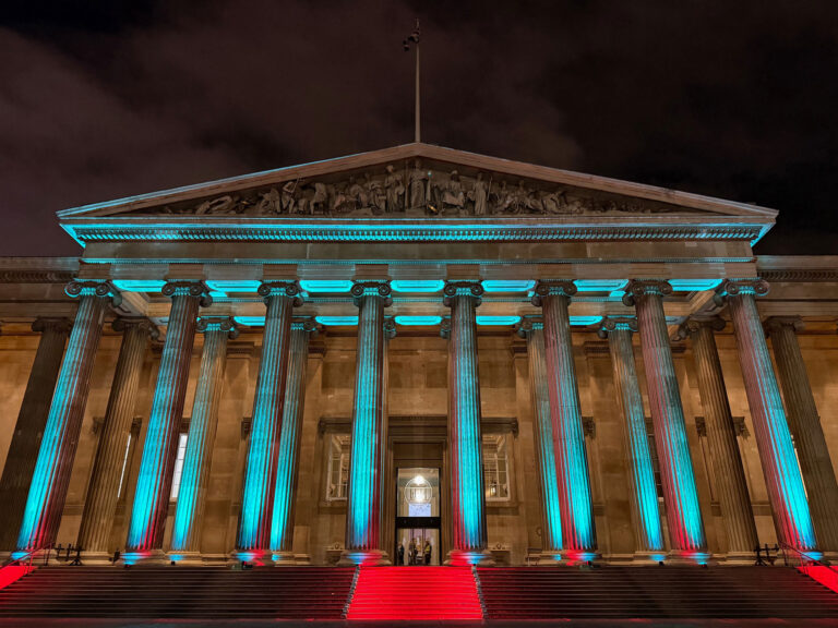 The British Museum lit in teal for an evening event, The Admirable Crichton
